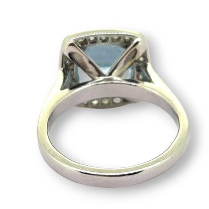 3ct Aquamarine and Diamond Cluster Engagement Ring in Platinum, 3ct aquamarine framed by a halo of round brilliant-cut diamonds in platinum with diamond-set shoulders