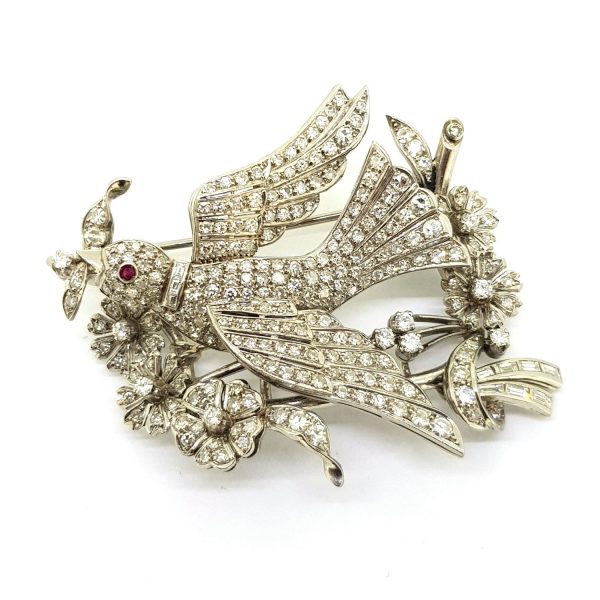 Entremble Diamond Bird Brooch, 5.00 carat total, featuring a bird in mid-flight within a flower and spray design set with 5cts baguette and brilliant-cut diamonds, in platinum and 18ct gold