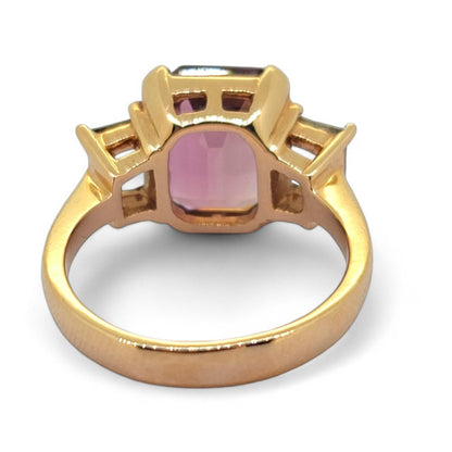 4.73ct Pink Tourmaline and Diamond Trilogy Engagement Ring in Rose Gold, emerald-cut pink tourmaline flanked by baguette-cut diamonds