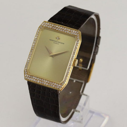 Vacheron Constantin 18ct Yellow Gold Manual Watch with Diamond Bezel; gold colour dial, original diamond bezel and diamond on dial at the centre of the Vacheron Constantin logo, on a Vacheron Constantin dark brown leather strap