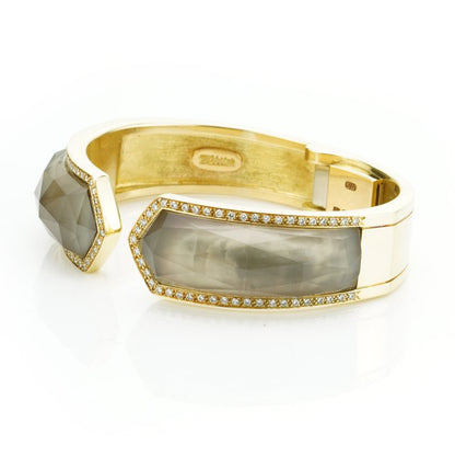 Stephen Webster Bangle Bracelet from Crystal Haze Collection; two faceted quartz crystal sections overlay a layer of Mother of Pearl, surrounded by 0.90cts brilliant cut diamonds, in 18ct yellow gold