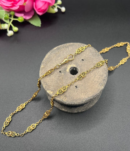 A yellow gold fancy link chain necklace