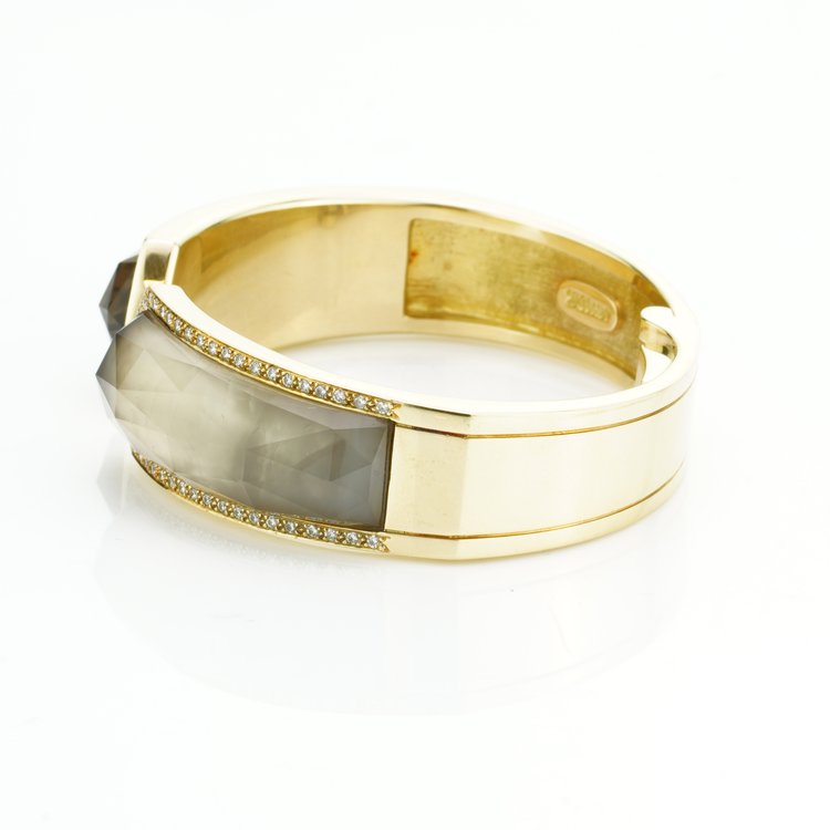 Stephen Webster Bangle Bracelet from Crystal Haze Collection; two faceted quartz crystal sections overlay a layer of Mother of Pearl, surrounded by 0.90cts brilliant cut diamonds, in 18ct yellow gold