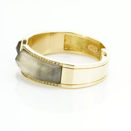 Stephen Webster Bangle Bracelet from Crystal Haze Collection; two faceted quartz crystal sections overlay a layer of Mother of Pearl, surrounded by 0.90cts brilliant cut diamonds, in 18ct yellow gold