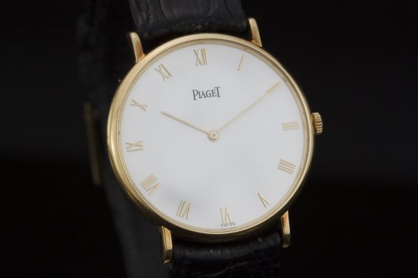 Piaget Classique 18ct Yellow Gold 33mm Manual Winding Watch; white dial, with original warranty / purchase document dated 1992 from Piaget Boutique Monaco - Avenue des Beaux-Arts