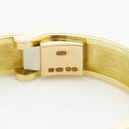 Stephen Webster Bangle Bracelet from Crystal Haze Collection; two faceted quartz crystal sections overlay a layer of Mother of Pearl, surrounded by 0.90cts brilliant cut diamonds, in 18ct yellow gold