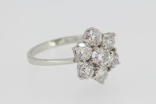Diamond Flower Cluster Ring; featuring seven round-brilliant cut diamonds, claw set, and mounted in 18ct white gold, 2.50 carat total