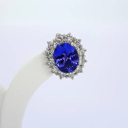 Tanzanite and Diamond Oval Cluster Earrings; 5.20cts oval faceted tanzanites surrounded by 1.76cts round brilliant-cut diamonds, in 18ct white gold