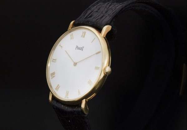 Piaget Classique 18ct Yellow Gold 33mm Manual Winding Watch; white dial, with original warranty / purchase document dated 1992 from Piaget Boutique Monaco - Avenue des Beaux-Arts