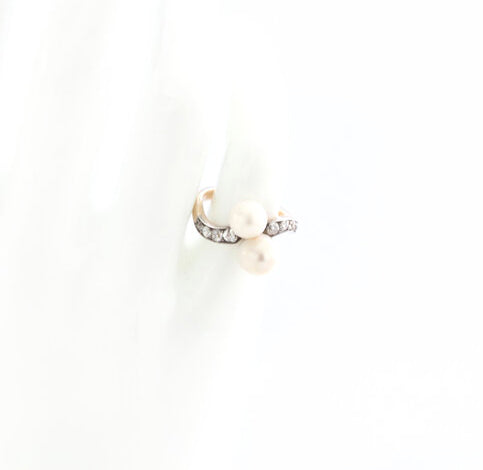 Art Deco Natural Pearl and Old Cut Diamond Ring; set with two natural freshwater pearls, accented with old-cut diamond set shoulders, in 18ct yellow gold. Circa 1920