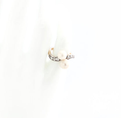Art Deco Natural Pearl and Old Cut Diamond Ring; set with two natural freshwater pearls, accented with old-cut diamond set shoulders, in 18ct yellow gold. Circa 1920