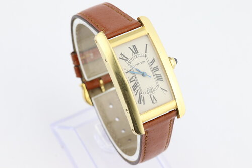 Cartier Tank Americaine Mid Size 18ct Yellow Gold Automatic Watch, Ref 1725, white guilloche dial, Roman numerals, date indicator at 6, blued steel hands, sapphire crystal, Cartier brown leather strap and pin buckle.