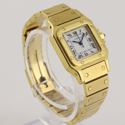Cartier Santos Ladies 24mm Automatic in 18ct Yellow Gold, white dial, Roman numerals, blue-steel hands, sapphire glass crystal, 18ct yellow gold bracelet with 18ct fold-over clasp, with a Cartier box.