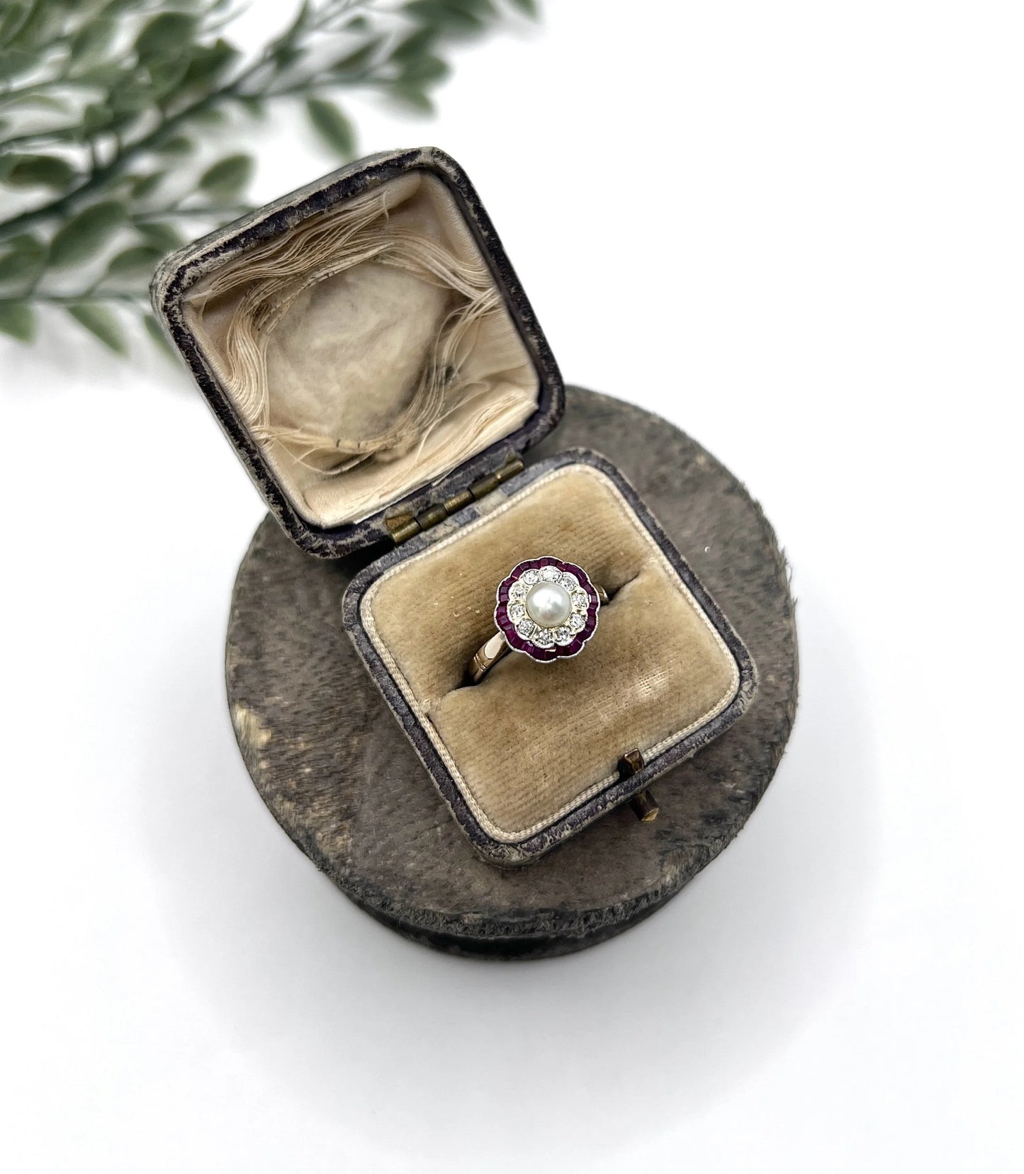 A pearl, diamond and ruby fancy cluster ring in platinum and yellow gold, in a ring box