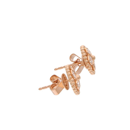 Diamond flower stud earrings in rose gold.