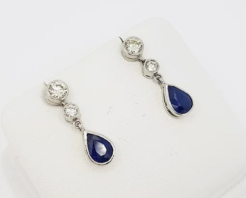 Sapphire and Diamond Drop Earrings; featuring 1.25cts pear-shaped sapphires suspended from 0.60cts brilliant cut diamonds, 18ct white gold