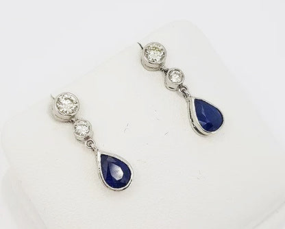 Sapphire and Diamond Drop Earrings; featuring 1.25cts pear-shaped sapphires suspended from 0.60cts brilliant cut diamonds, 18ct white gold