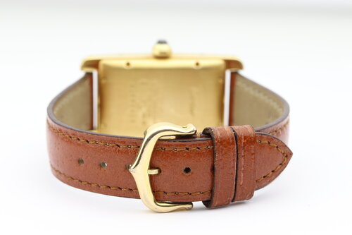 Cartier Tank Americaine Mid Size 18ct Yellow Gold Automatic Watch, Ref 1725, white guilloche dial, Roman numerals, date indicator at 6, blued steel hands, sapphire crystal, Cartier brown leather strap and pin buckle.