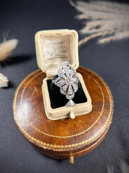 A diamond cocktail ring in white metal, in an antique ring box