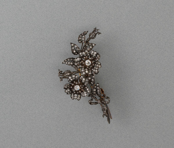 Antique Victorian 3ct Old Cut Diamond Rose Flower Brooch; a bouquet of roses with bow detail, set with 3.00 carats old-cut diamonds, set in silver and gold.