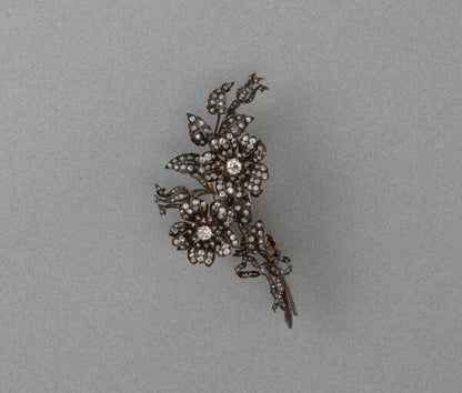 Antique Victorian 3ct Old Cut Diamond Rose Flower Brooch; a bouquet of roses with bow detail, set with 3.00 carats old-cut diamonds, set in silver and gold.