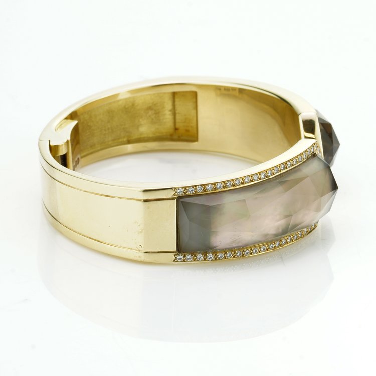 Stephen Webster Bangle Bracelet from Crystal Haze Collection; two faceted quartz crystal sections overlay a layer of Mother of Pearl, surrounded by 0.90cts brilliant cut diamonds, in 18ct yellow gold