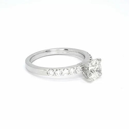 Diamond Solitaire Engagement Ring; round brilliant cut diamond, claw-set, accented with diamond set shoulders, 1.01 carats, in platinum