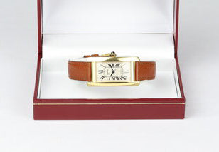 Cartier Tank Americaine Mid Size 18ct Yellow Gold Automatic Watch, Ref 1725, white guilloche dial, Roman numerals, date indicator at 6, blued steel hands, sapphire crystal, Cartier brown leather strap and pin buckle.