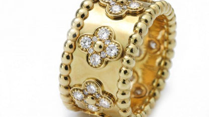 Vintage Van Cleef and Arpels Perlee Clover Floral Diamond Band Ring; 1.40 carats. Circa 1990s