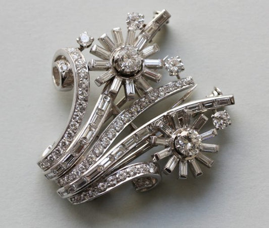 Vintage 9.50ct Diamond and Platinum Floral Spray Double Clip Brooch; two flowers set with baguette and brilliant-cut diamonds, flowers can separated, 1950s