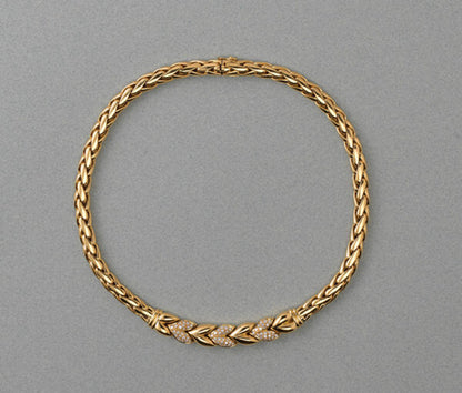 Vintage Steltman 18ct yellow gold rope necklace with six stylised leaves, three of which are set with 1.50cts brilliant cut diamonds, Signed, Circa 1980.