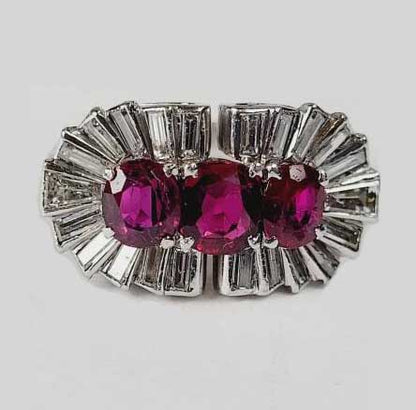 Vintage 1940s Ruby and Baguette Diamond Cocktail Ring; three rubies totalling 2 carats surrounded by 1.50cts baguette and tapering baguette diamonds in platinum