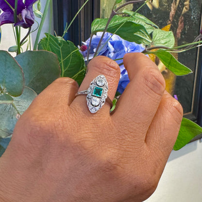 Art Deco 18 Carat White Gold, Platinum, Emerald and Diamond Marquise Navette Ring