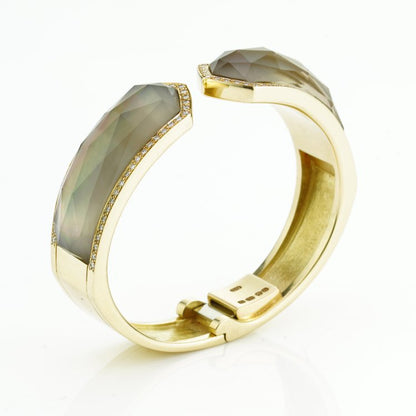 Stephen Webster Bangle Bracelet from Crystal Haze Collection; two faceted quartz crystal sections overlay a layer of Mother of Pearl, surrounded by 0.90cts brilliant cut diamonds, in 18ct yellow gold