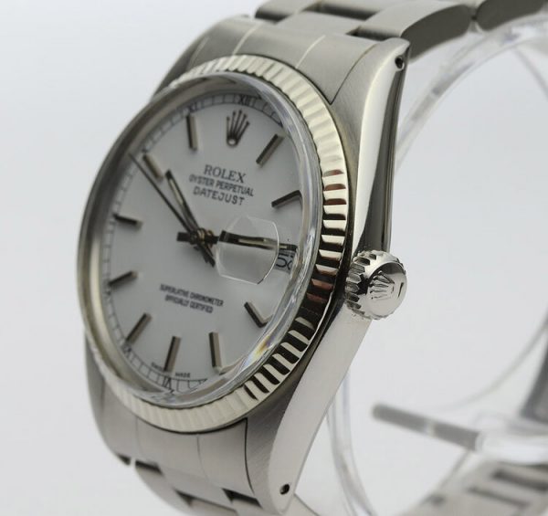 Vintage Rolex Oyster Perpetual Datejust 16014 36mm Stainless Steel Automatic; white dial, baton hour markers, quick-set magnified date, white gold bezel, acrylic crystal and screwdown crown, on a stainless steel Oyster bracelet with fold-over clasp, Circa 1980s