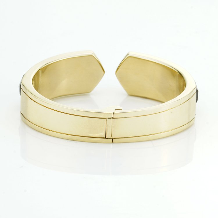 Stephen Webster Bangle Bracelet from Crystal Haze Collection; two faceted quartz crystal sections overlay a layer of Mother of Pearl, surrounded by 0.90cts brilliant cut diamonds, in 18ct yellow gold