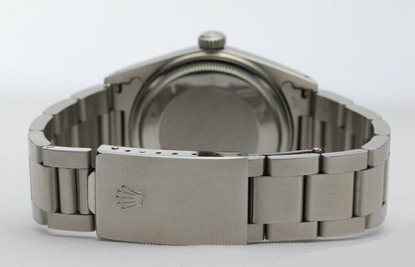 Vintage Rolex Oyster Perpetual Datejust 16014 36mm Stainless Steel Automatic; white dial, baton hour markers, quick-set magnified date, white gold bezel, acrylic crystal and screwdown crown, on a stainless steel Oyster bracelet with fold-over clasp, Circa 1980s