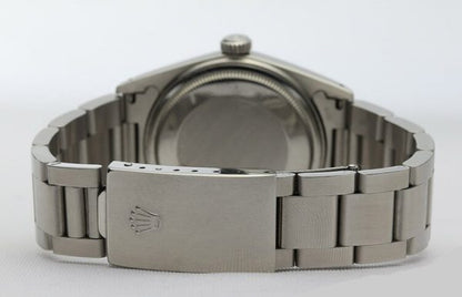 Vintage Rolex Oyster Perpetual Datejust 16014 36mm Stainless Steel Automatic; white dial, baton hour markers, quick-set magnified date, white gold bezel, acrylic crystal and screwdown crown, on a stainless steel Oyster bracelet with fold-over clasp, Circa 1980s