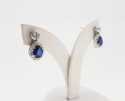 Sapphire and Diamond Pear Shaped Cluster Drop Earrings; 1.23cts sapphires surrounded by diamonds, suspended from diamond stud, 18ct white gold