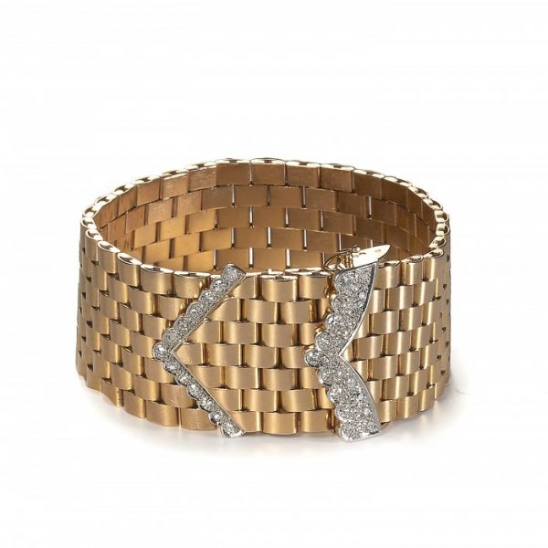 Vintage French Gold and Diamond Bracelet; wide belt and buckle design comprised of seven rows of brick-style links accented with two single-cut diamond set "V" sections, 18ct yellow gold, Circa 1950