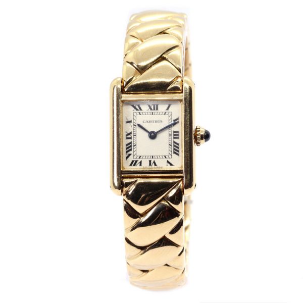 Cartier Tank Louis 18ct Yellow Gold Ladies Quartz Watch; white dial with Roman numerals, inner minutes track, sapphire crystal, blue cabochon gem set crown, on 18ct yellow gold bracelet with Cartier double deployant clasp, with a Cartier box