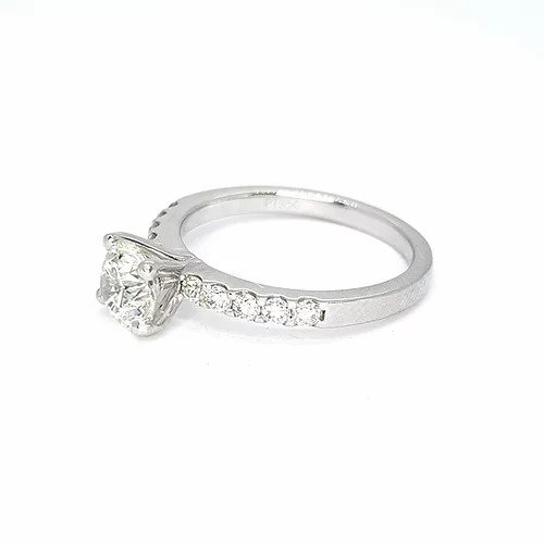 Diamond Solitaire Engagement Ring; round brilliant cut diamond, claw-set, accented with diamond set shoulders, 1.01 carats, in platinum