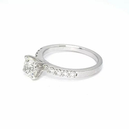 Diamond Solitaire Engagement Ring; round brilliant cut diamond, claw-set, accented with diamond set shoulders, 1.01 carats, in platinum