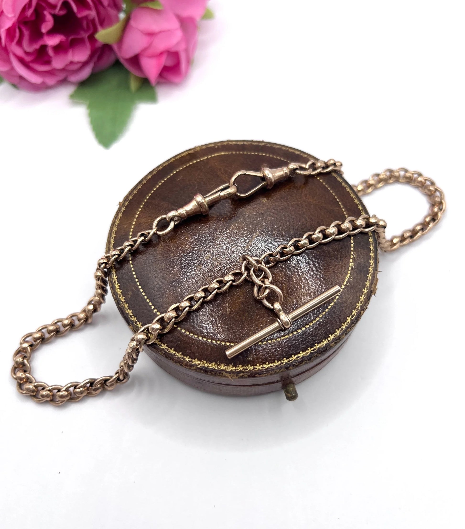 A rose gold fancy link Albert chain necklace with a T-bar attachment