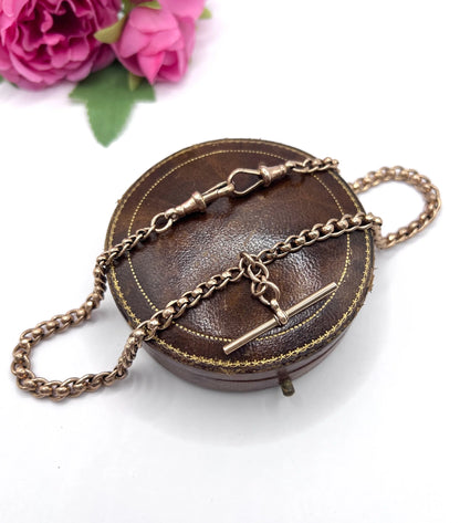 A rose gold fancy link Albert chain necklace with a T-bar attachment