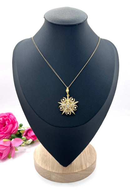 A yellow gold star and crescent brooch/pendant with pearls and a diamond centre, with a chain