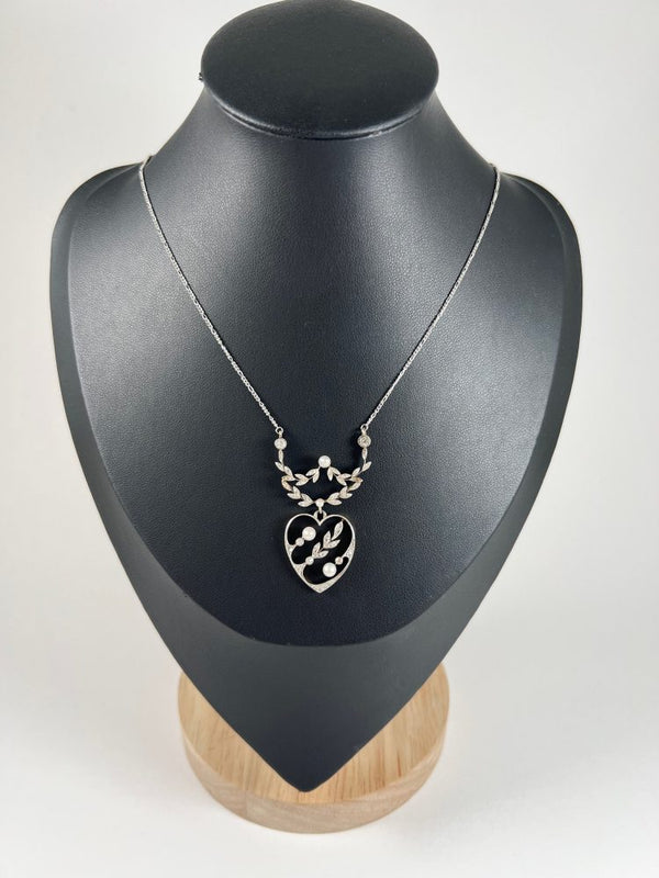 Edwardian heart pendant necklace in platinum and white gold with pearls and diamonds.
