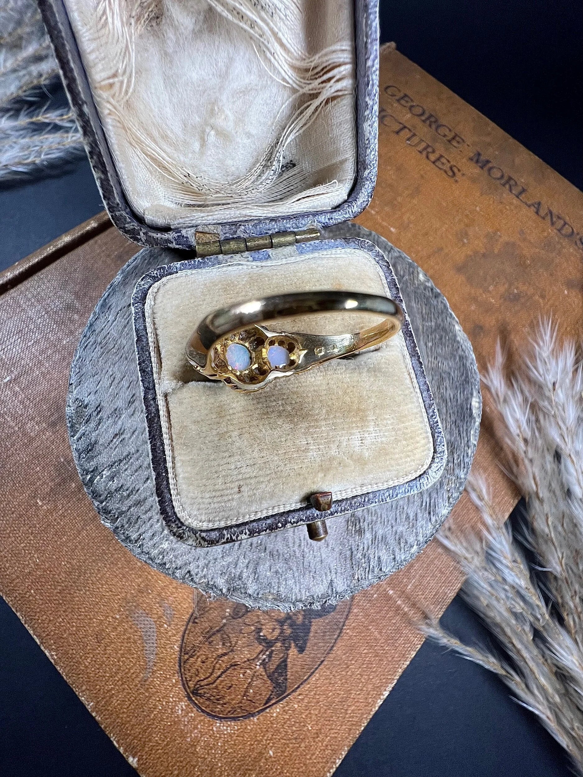 A yellow gold opal and diamond dress ring