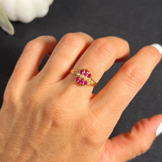 A yellow gold ruby and pearl cluster ring, modelled on a hand