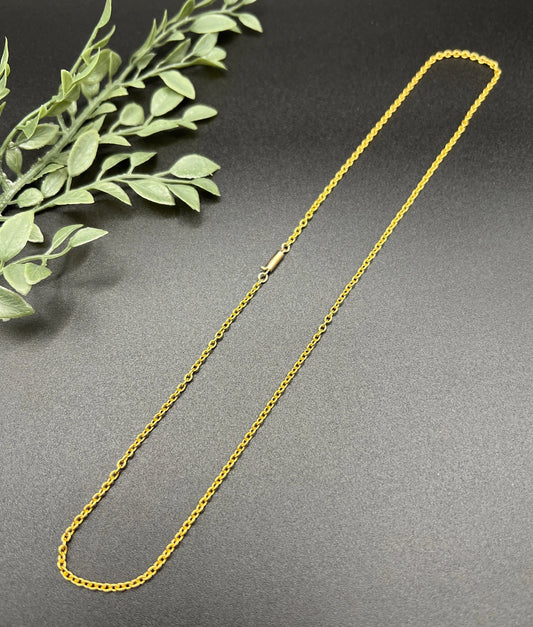 A yellow gold trace link chain necklace